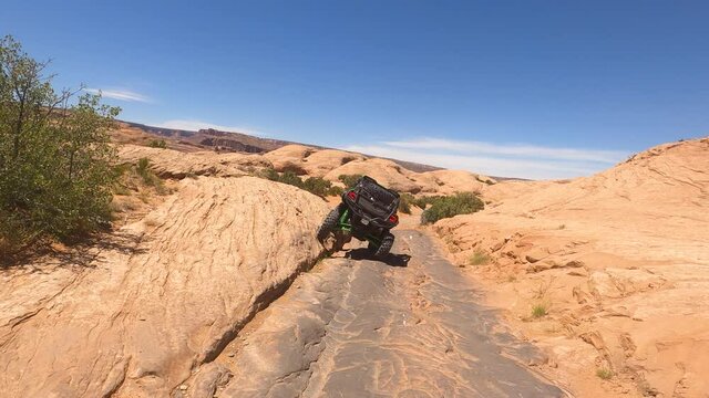 Extreme off road 4x4 recreation fun POV 4K. In south eastern Utah desert. Tourists and visitors worldwide come to nearby Arches and Canyonlands National Parks.