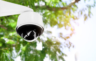 Modern public CCTV camera on a electric pole with blurred natural background. Intelligent...