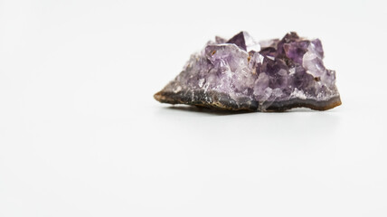 Purple crystal with a white background