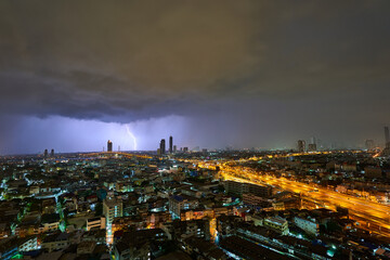 Fototapeta na wymiar Lightning strike in the City at Night Time Thailand