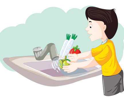 a boy washing vegetable