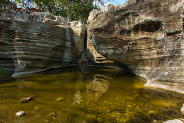 Beautiful view, close up of a karst rock raising from the river. Luweng Sampang Special Region of Yogyakarta. Indonesia.