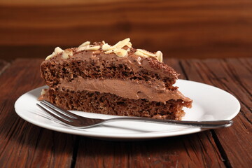 Chocolate sandwich cake garnished with flaked almonds