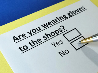 Obraz premium One person is answering question about wearing gloves to shops.
