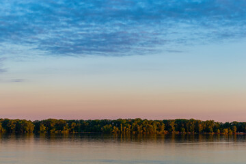 Magic dawn over a wide river