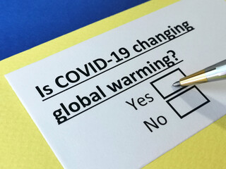 Obraz premium One person is answering question about covid-19 effects on global warming.