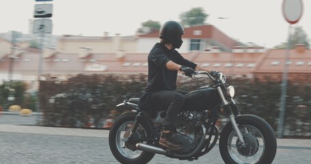 Fototapeta na wymiar Biker riding on motorcycle in city