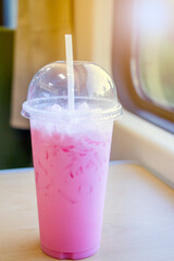 Pink iced milk on the table