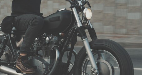 Fototapeta na wymiar Biker riding on motorcycle in city