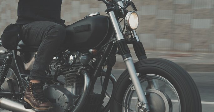 Biker riding on motorcycle in city