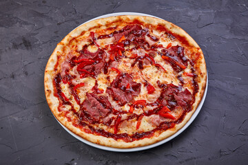 pizza with bacon, salami and mozzarella