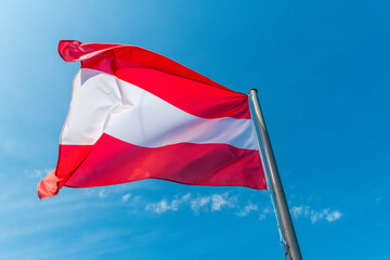 Fototapeta na wymiar Austrian Flag on post