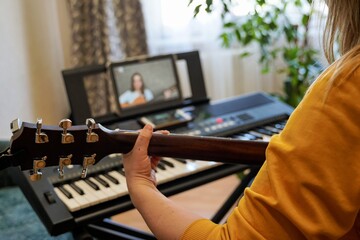 Female musicians rehearsing online at home during self-isolation due to pandemic COVID-19.