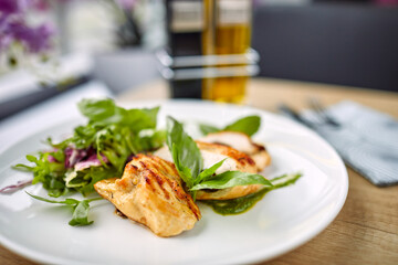 grilled chicken breast and salad