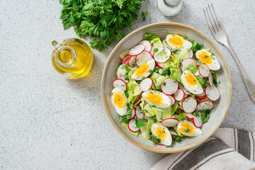 Healthy salad with  radish and boiled egg. top view