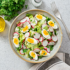 Healthy salad with  radish and boiled egg. top view