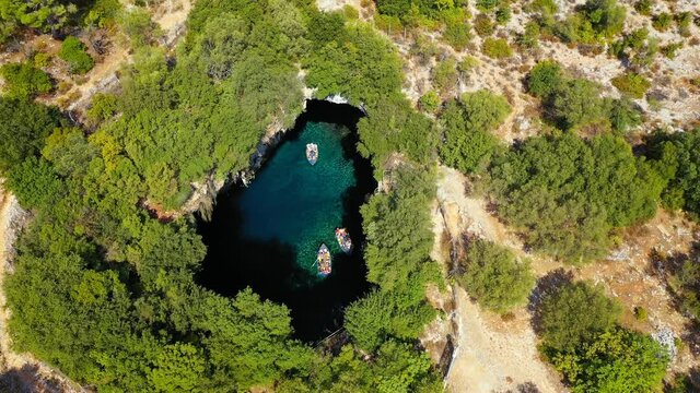 Famous Melissani lake on Kefalonia island, Karavomylos, Greece. On top of Melissani Cave (Melissani Lake) in Karavomylos village in Kefalonia island , Greece. Melissani Cave viewed from above.