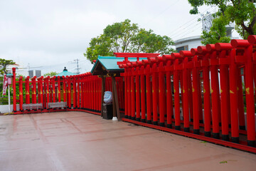 Red Tori gate at Sairaiin (Daruma Temple) in Naha, Okinawa, Japan 