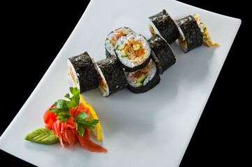 Sushi roll with salmon and shrimp tempura.