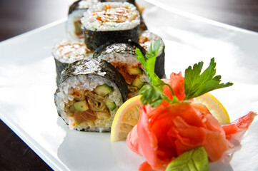 Sushi roll with salmon and shrimp tempura.