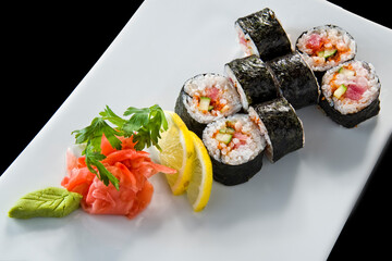 Sushi roll with salmon and shrimp tempura.