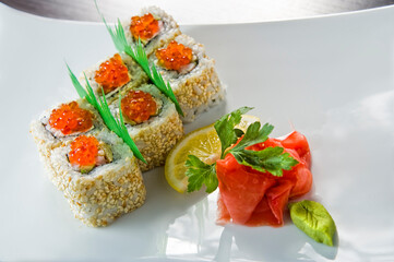 Sushi roll with salmon and shrimp tempura.
