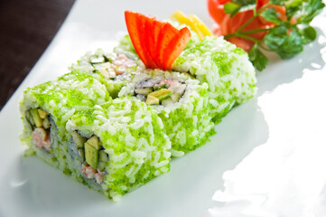 Sushi roll with salmon and shrimp tempura.