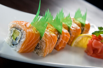 Sushi roll with salmon and shrimp tempura.