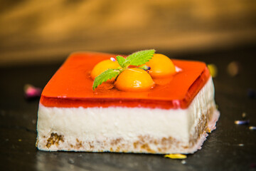 Sweet dessert with different fresh fruit and decorations. Sweet homemade dessert.Closeup.