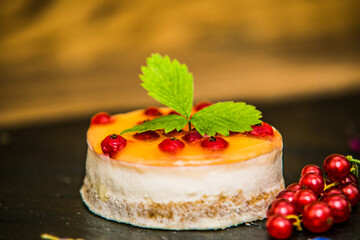 Sweet dessert with different fresh fruit and decorations. Sweet homemade dessert.Closeup.