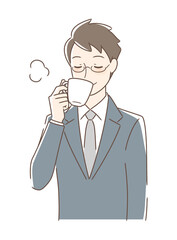 マグカップのコーヒーを飲む男性