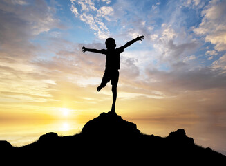Happy silhouette of boy enjoy the nature.