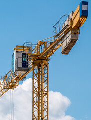 Close up details of a construction crane.Turret Slewing Crane against blue sky