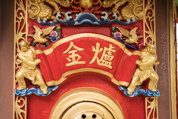 Detail images of colorful Taoist temple with dragons and gods to protect farmers and farms in rural...