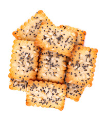 Square poppy seeds and sesame crackers isolated on white background. Dry cracker cookies isolated. Salty snacks isolated. Top view.