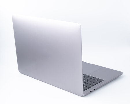 Soft focus of modern laptop with a blank screen, aluminum body material, isolated on white background. Clipping path
