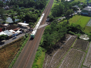 aerial view of the city of train crossing the gates