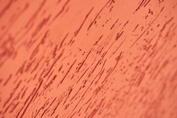 Decorative plaster on the wall. Color orange texture background.