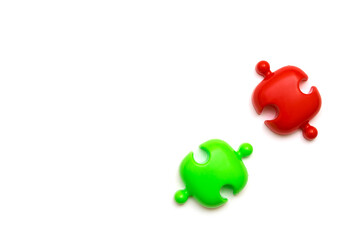 Red and green puzzles on a white background.Social distance concept to prevent the spread of coronavirus COVID-19.Flat lay, copy space for text