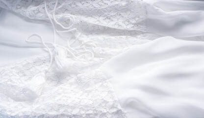 Obraz premium Chiffon and lace close up fabric, fashionable vintage wedding details 