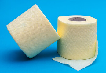 Two roll of toilet paper on blue.