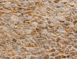 texture of colored old stone wall close up , retro bricks background macro , vintage bricklaying surface backdrop
