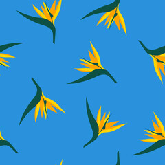 Floral tropical seamless vector pattern. Stylized yellow Strelitzia flowers on a blue background in flat style. Pattern with exotic strelitzia flowers for print, textile, cards, design.