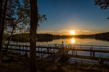 Fototapeta na wymiar Stockholm, Sweden The suns sets over a dock on Lake Malaren.