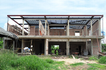Perspective house under construction with clear blue sky background