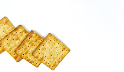 Cream cracker biscuit isolated on white background with copy space.