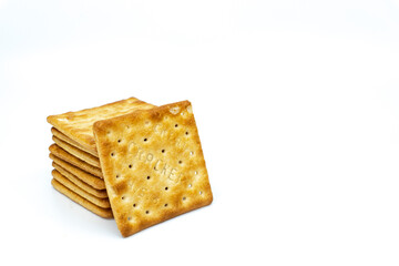 Cream cracker biscuit isolated on white background with copy space.
