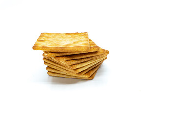 Cream cracker biscuit isolated on white background with copy space.