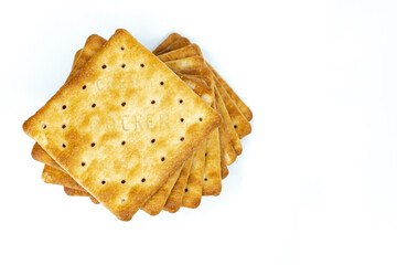 Cream cracker biscuit isolated on white background with copy space.