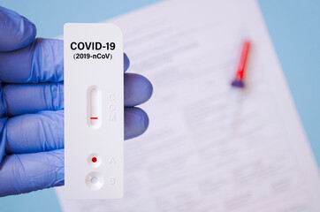Positive test result by using rapid test for COVID-19, quick fast antibody point of care testing....